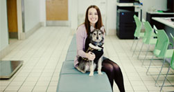 Young woman holding dog